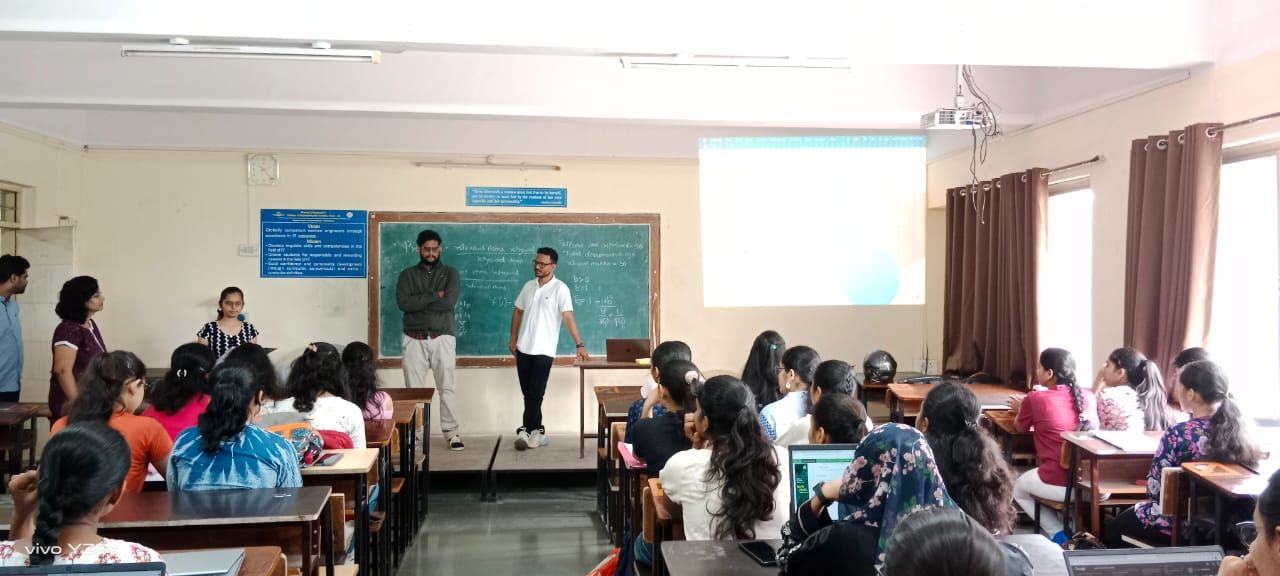 Sibu Stephen interacting with students in a classroom. 