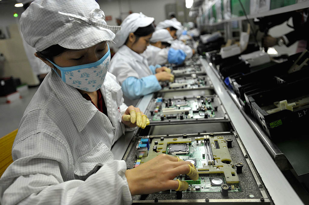 Workers Assemble Electronic Components in Shenzhen, China via Jacobin