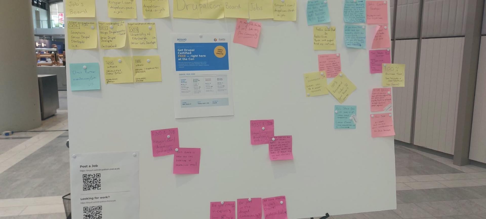 Close view of the jobs board showing numbered vacancies, job-seeker cards, QR codes and handwritten recommendations.