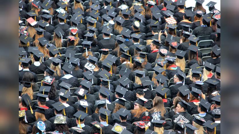 A see of college graduates at the commencement ceremony.