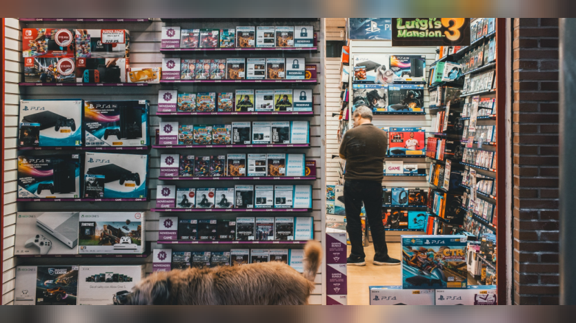 a person looking at racks in a shop