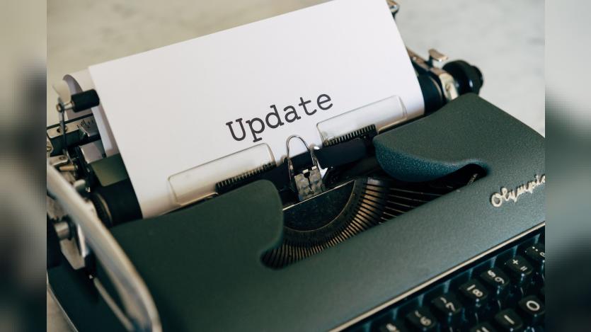 A sheet reading update is being typed in a typewriter