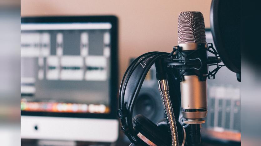 Black and silver headphones on black and silver microphone
