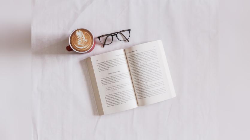 A book, cup of coffee and a spectacle