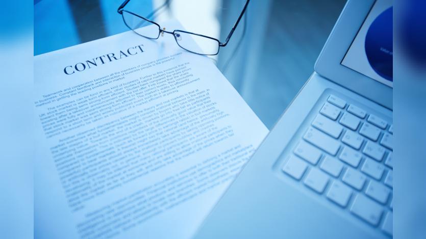  business document and laptop on the desk