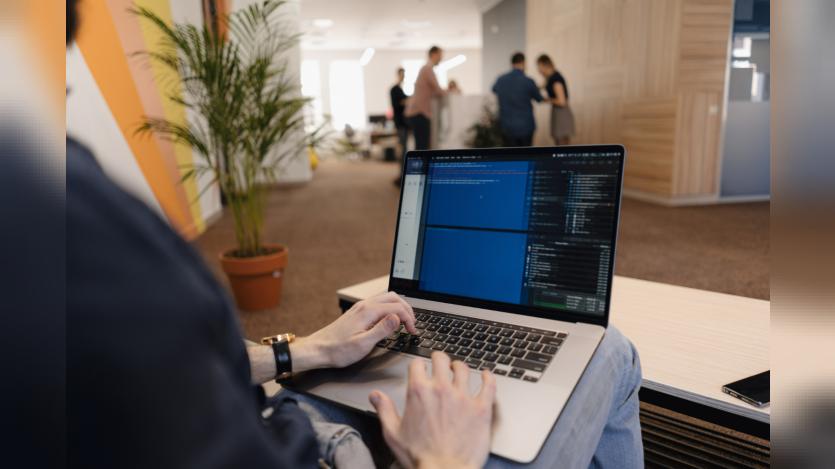 a person working in laptop