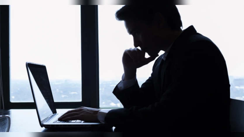 man staring at the laptop