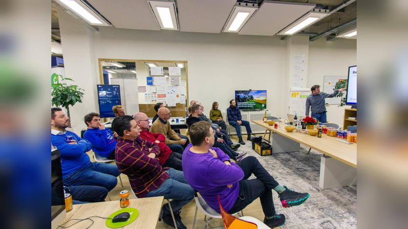 a group of people listening to a session
