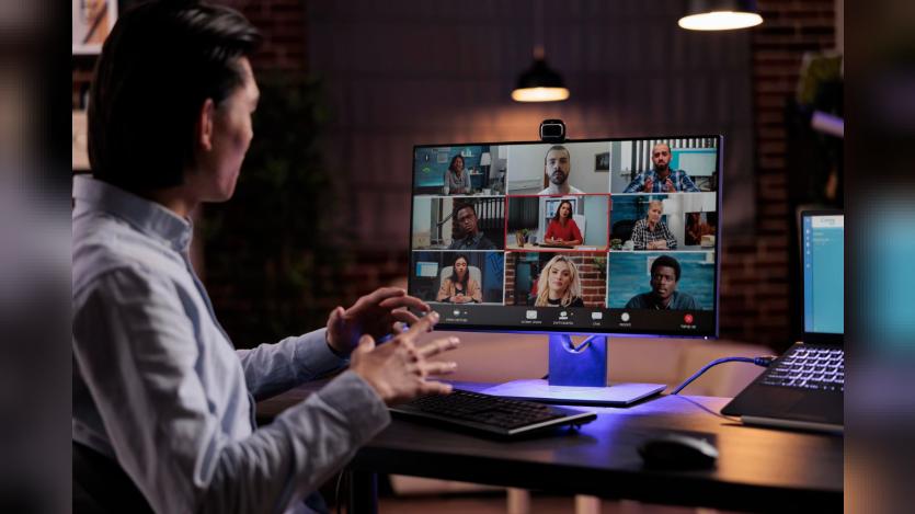 office worker using videocall conference to meet with business people on webcam