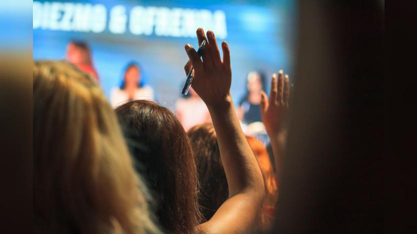 woman raising hand