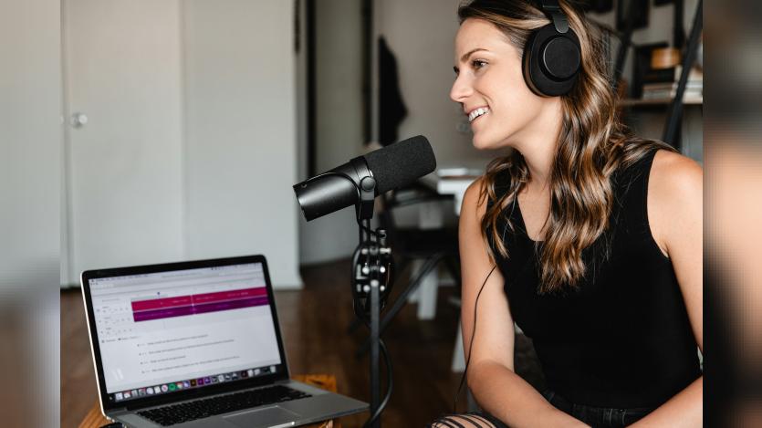 woman talking into a microphone
