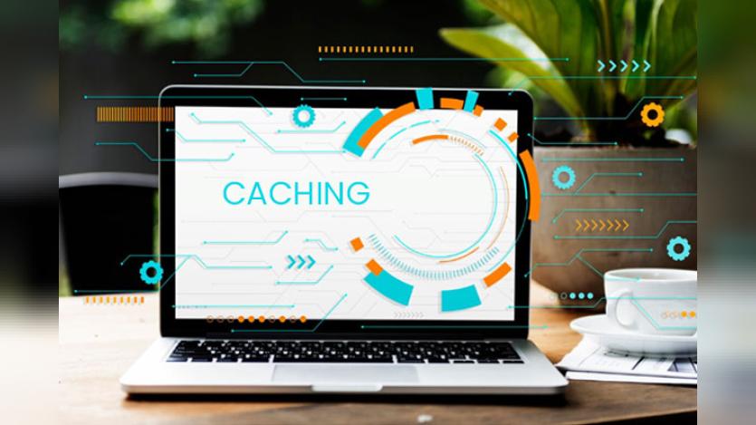 Laptop screen shows caching