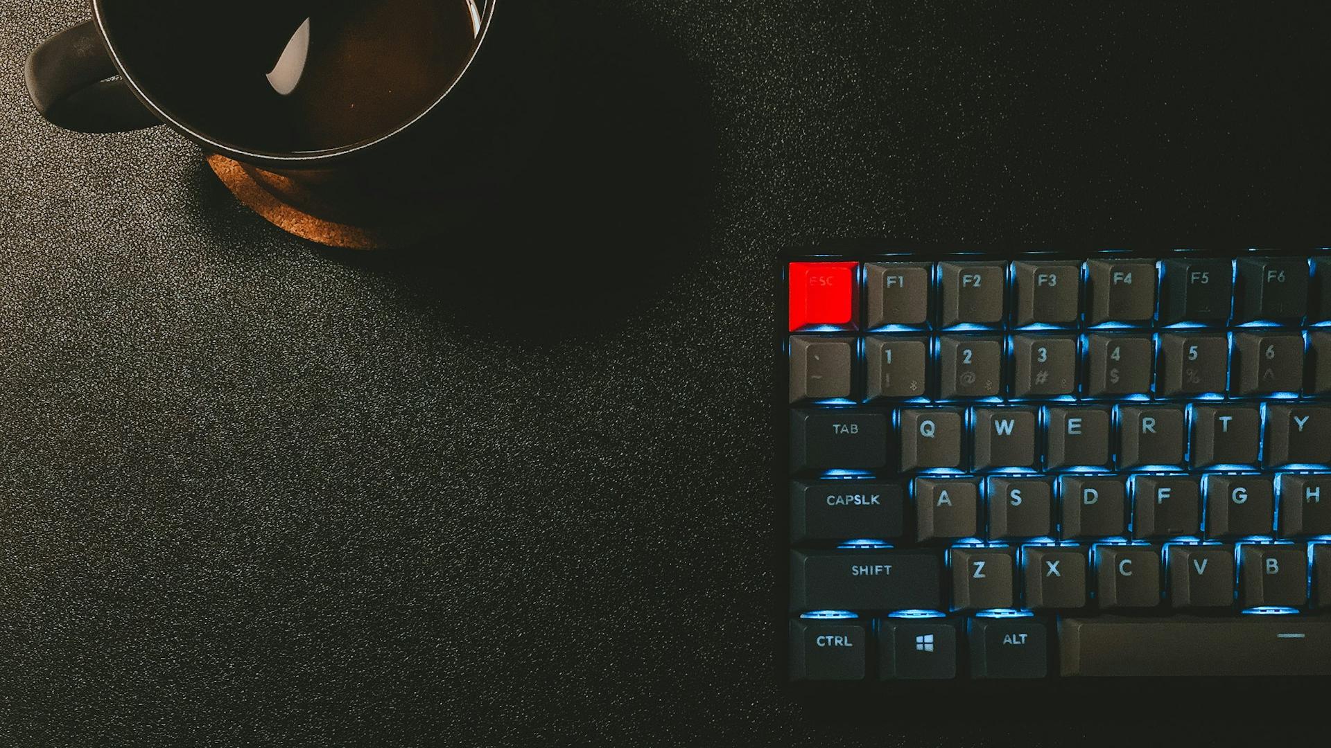 keyboard and black mug