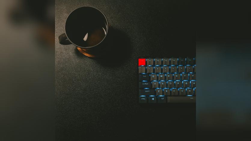 keyboard and black mug