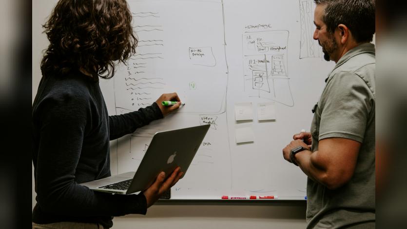 two people working together