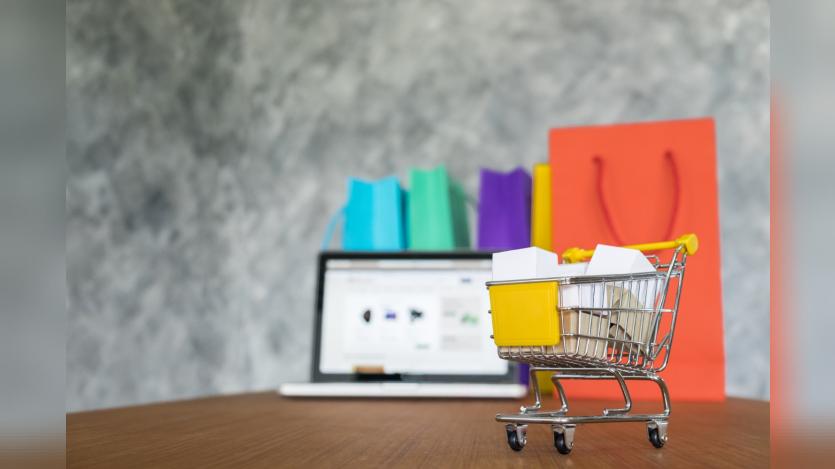 Laptop and shopping bags, online shopping concept