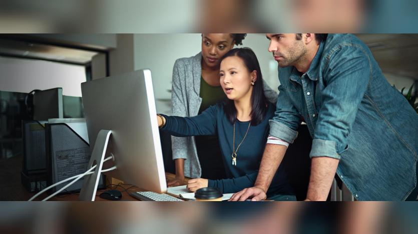 People works on a system in an office space