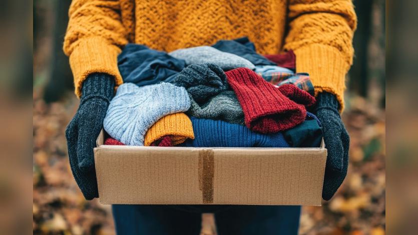 AI generated image of a pair of hand holding a box of woolen clothes