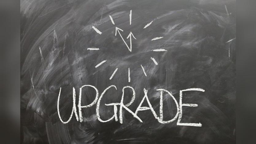 Graphical representation of 'Upgrade' written on a black board