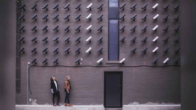 Women look at security cameras