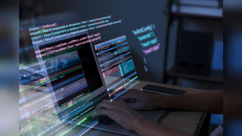Programming background with person working with codes on computer