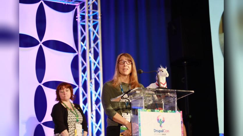 Kristen Pol addressing attendees during the Aaron Winborn Award presentation at DrupalCon Atlanta 2025.