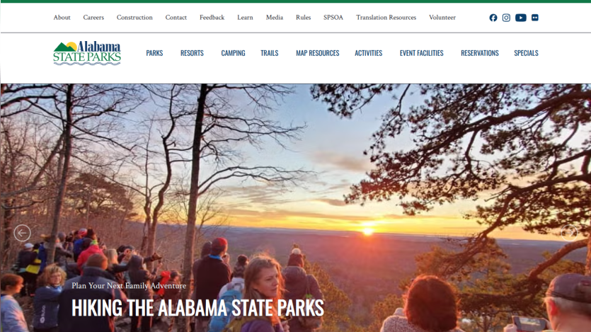 Promotional banner for hiking in Alabama State Parks with scenic sunset view.