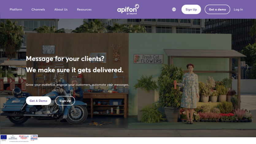 Website hero section with headline about message delivery, call-to-action buttons, and background image of a woman and motorcycle in an urban setting