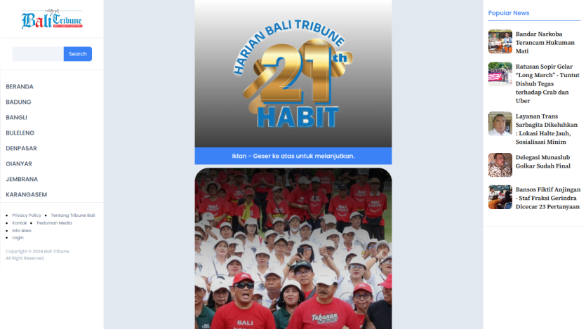 Bali Tribune news website with navigation menu, 21st Habit logo, crowd photo, and popular news list