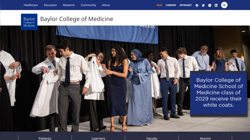 Baylor College of Medicine students receiving their white coats during a ceremony.