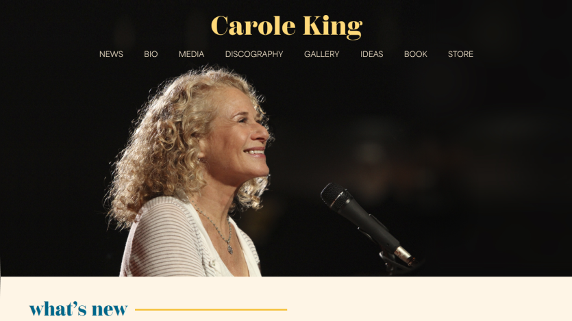 Carole King website header with navigation and a smiling woman speaking into a microphone