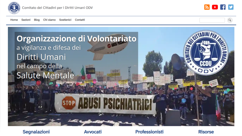 Homepage of an organization advocating for human rights in mental health, featuring a protest image.