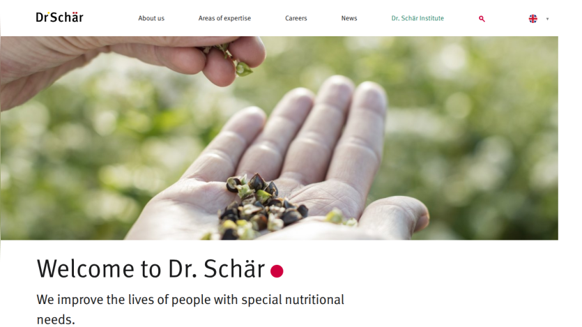 Website header and hero section with hands holding seeds and welcome message about improving lives with special nutritional needs.