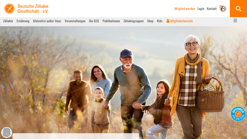 Website header and navigation of Deutsche Zöliakie Gesellschaft with a hero image of a smiling multigenerational family walking outdoors