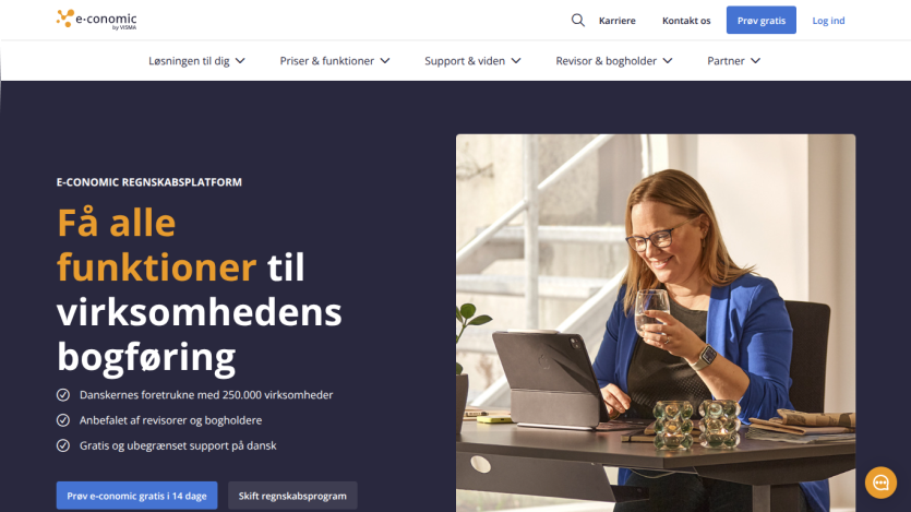 Website offering accounting solutions with a woman using a laptop and key features highlighted.