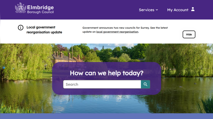 Elmbridge Borough Council website with local government update and search bar over a scenic pond background