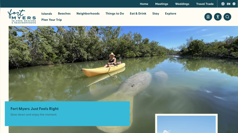 Fort Myers tourism site with navigation and hero image of a woman kayaking near a manatee in calm water