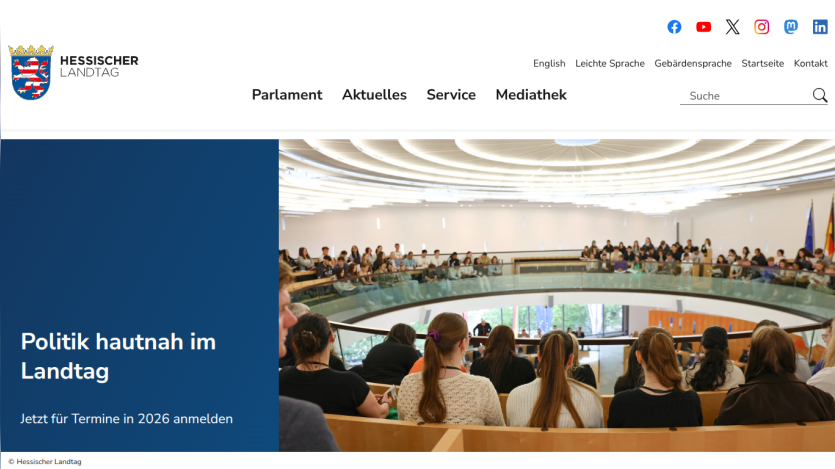 Hessischer Landtag website with navigation and a hero image showing an audience in a parliamentary setting