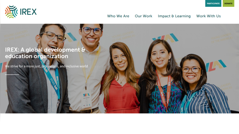 IREX homepage featuring a group of smiling individuals and a tagline about global development.