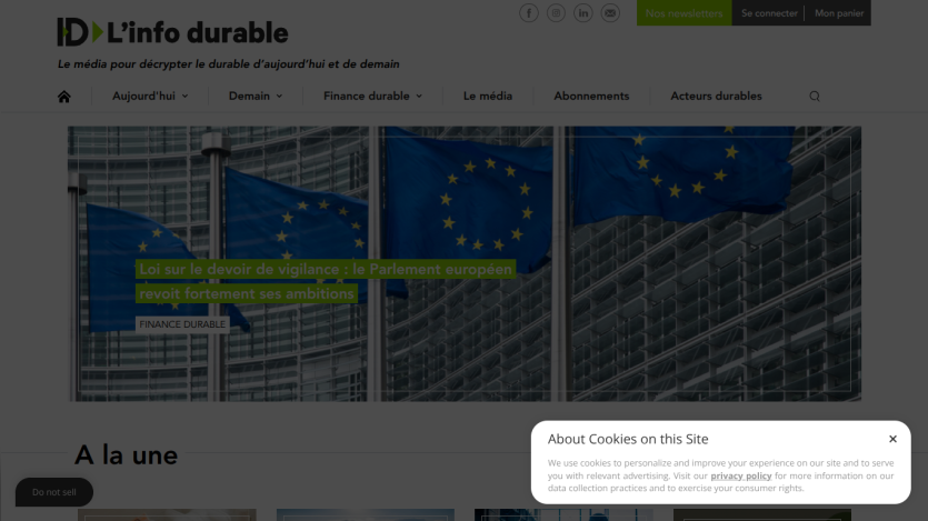 Sustainable development news site with headline and European Union flag images, cookie consent banner visible but unobtrusive
