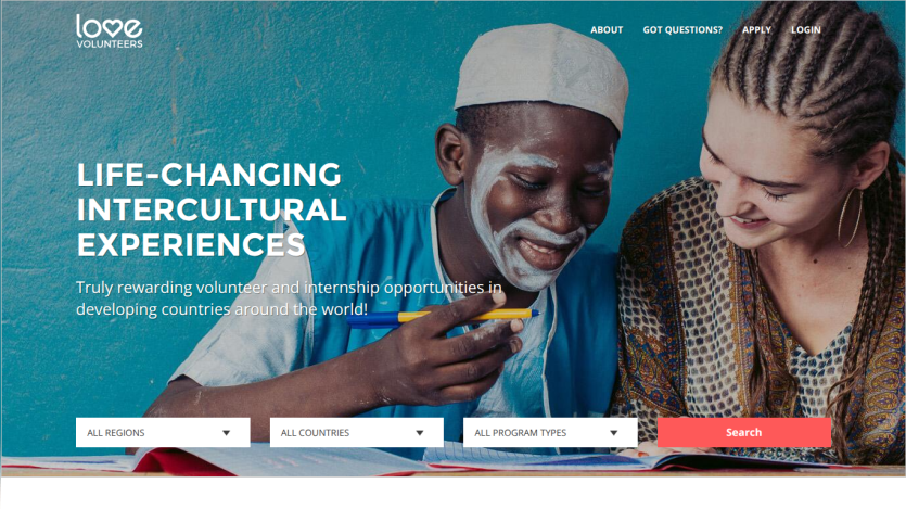 Homepage featuring two individuals engaged in an educational activity with a tagline about intercultural experiences.