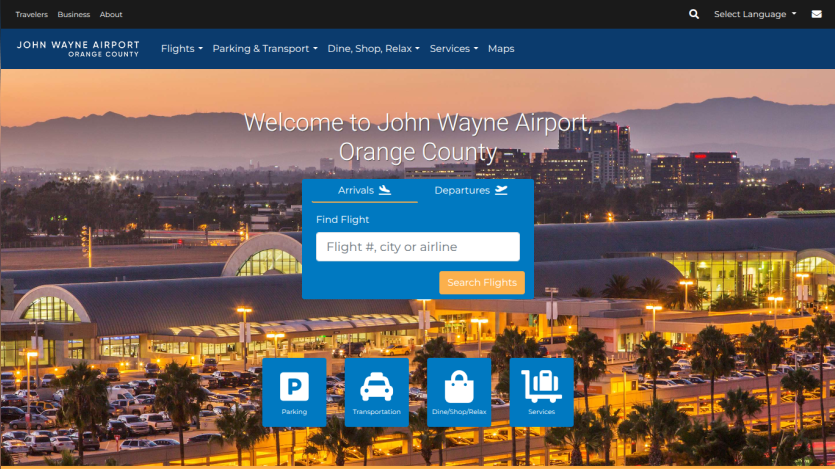 John Wayne Airport homepage with navigation bar, cityscape background, and flight search form