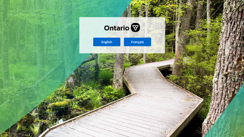 Ontario government login page with English and French language options over a forest boardwalk background