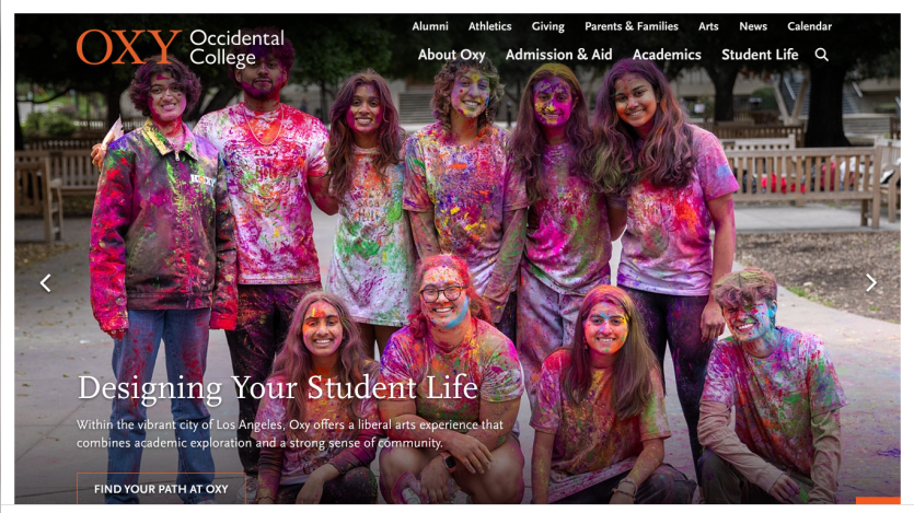 Occidental College homepage featuring students celebrating with colorful powder, promoting student life.