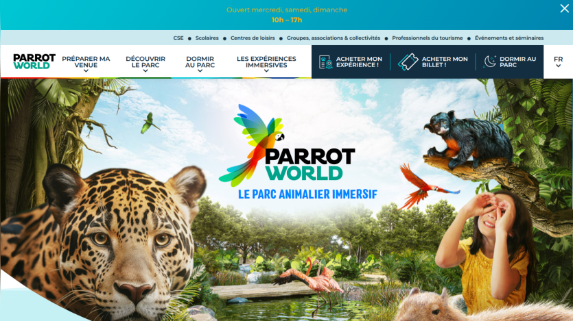 Parrot World immersive animal park homepage with navigation menu, logo, and vibrant animal and nature scene