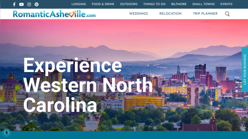 Homepage promoting experiences in Western North Carolina with a cityscape background.