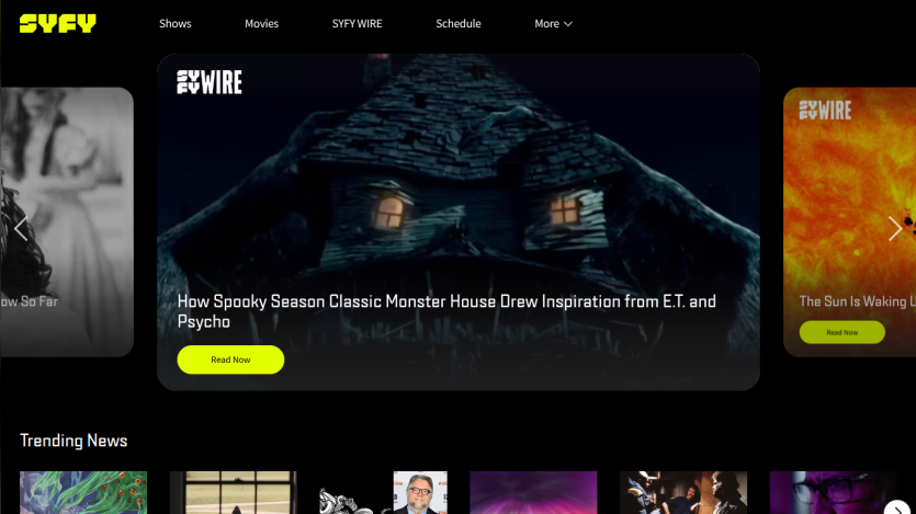 SYFY website with navigation menu and featured article on spooky season classic monster house inspired by E.T. and Psycho