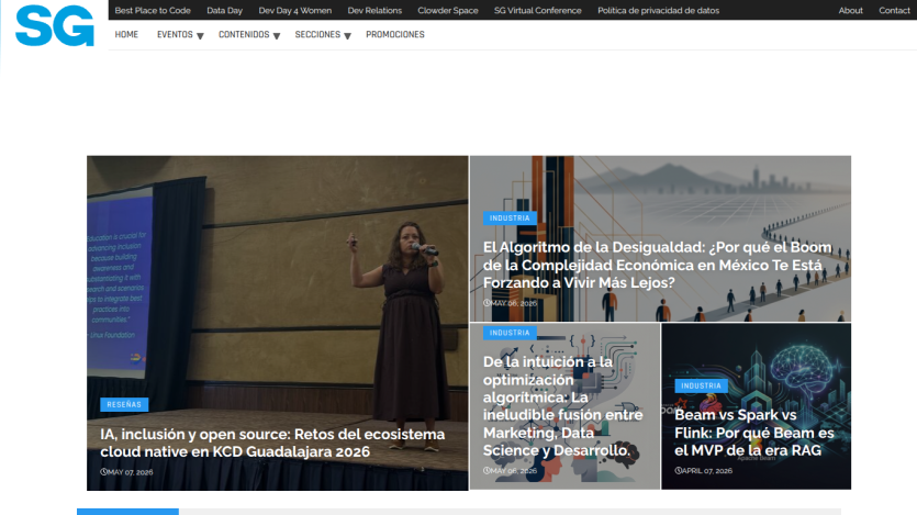 Homepage featuring articles on economic inclusion and opportunities, with a speaker on stage.