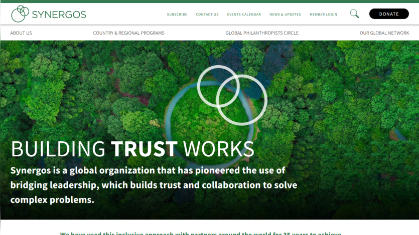 Homepage with navigation bar, large hero image of a mountain landscape, headline 'Explore the World', and a call-to-action button