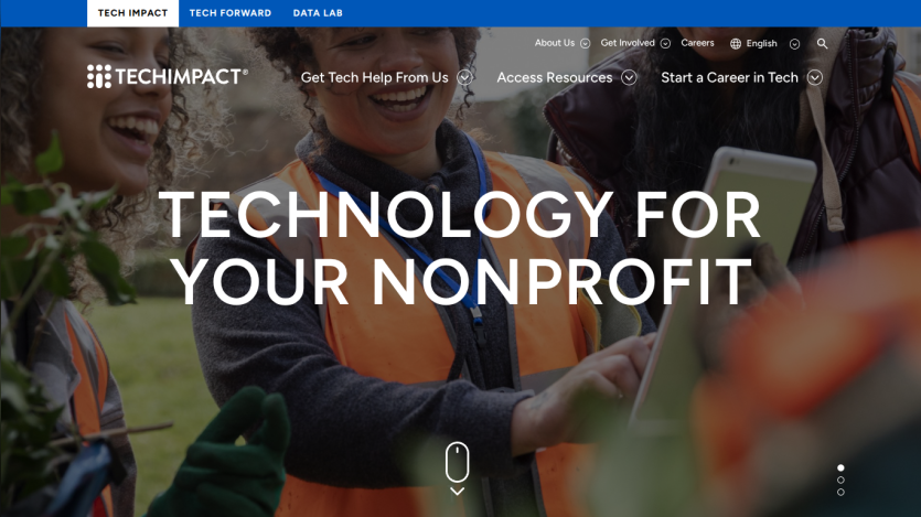 TechImpact homepage offering technology solutions for nonprofits with navigation links and a smiling group outdoors